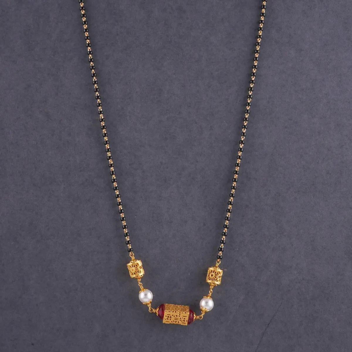 Beautiful Gold Antique Small Mangalsutra for Ladies in Drop Shape with Beautiful Stones 