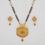 Adoreable Gold Mangal Sutra Pendant Set with Earring for Ladies in Beautiful Design 