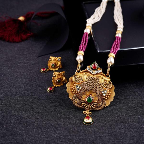 Amazing Gold Pendant Set for Ladies with Elegant work in Antique Design 