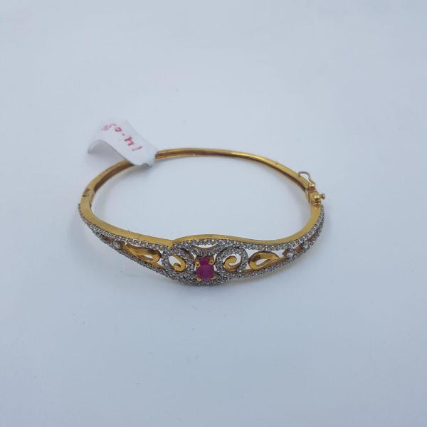 Gold Ladies Bracelet Studded with Zerkons and Red Stone