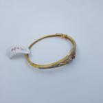 Gold Ladies Bracelet Studded with Zerkons and Red Stone