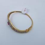 Gold Ladies Bracelet Studded with Zerkons and Red Stone